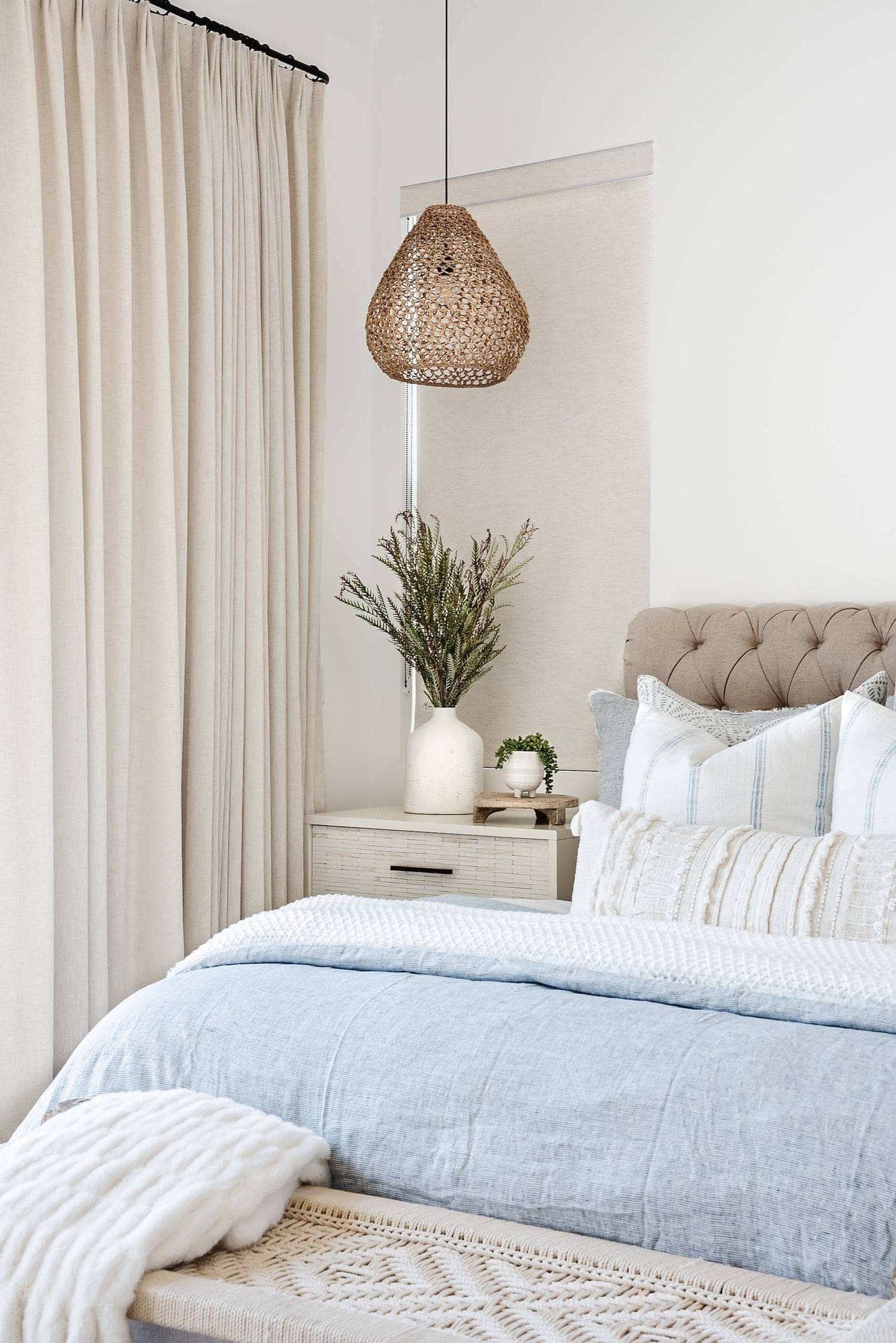 A finished Austin bedroom install, bed dressed and nightstand styled