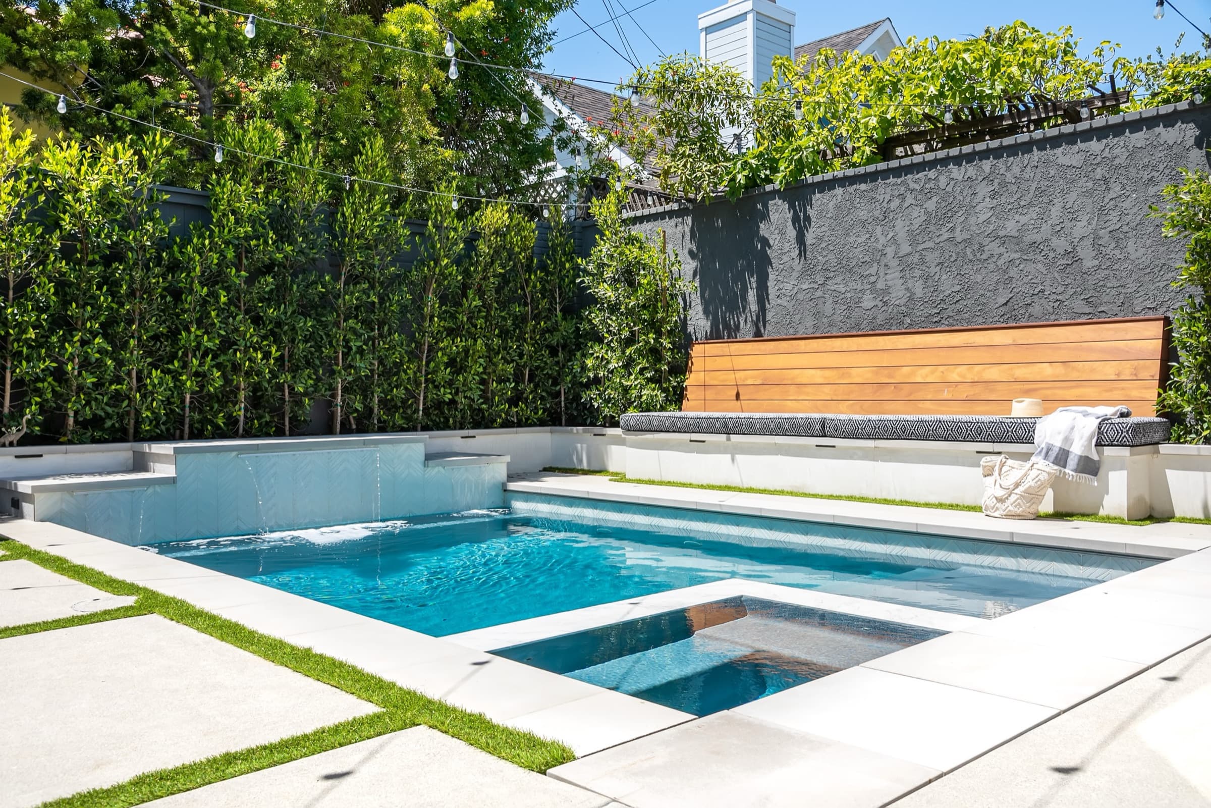 A pool terrace and shaded seating at a luxury Austin home